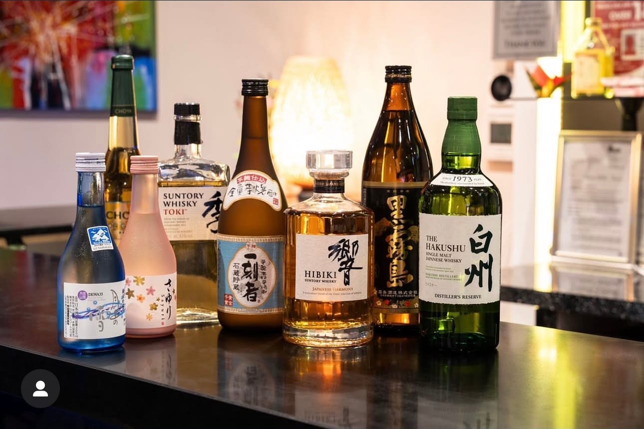 Bottles of sake, shochu and Japanese whisky on the bar at Momo